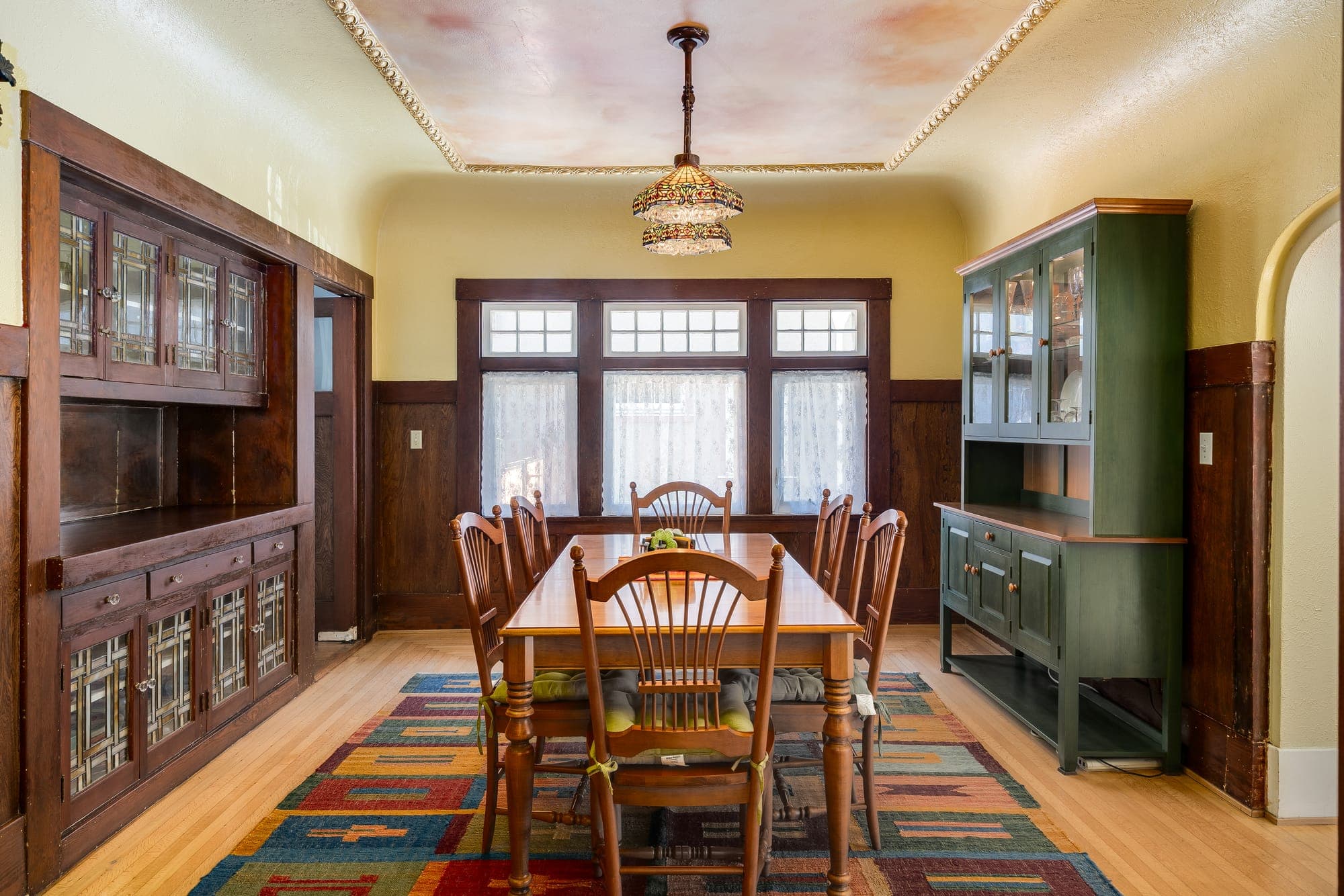 The dining room's built-in buffet and leaded-glass cabinetry.