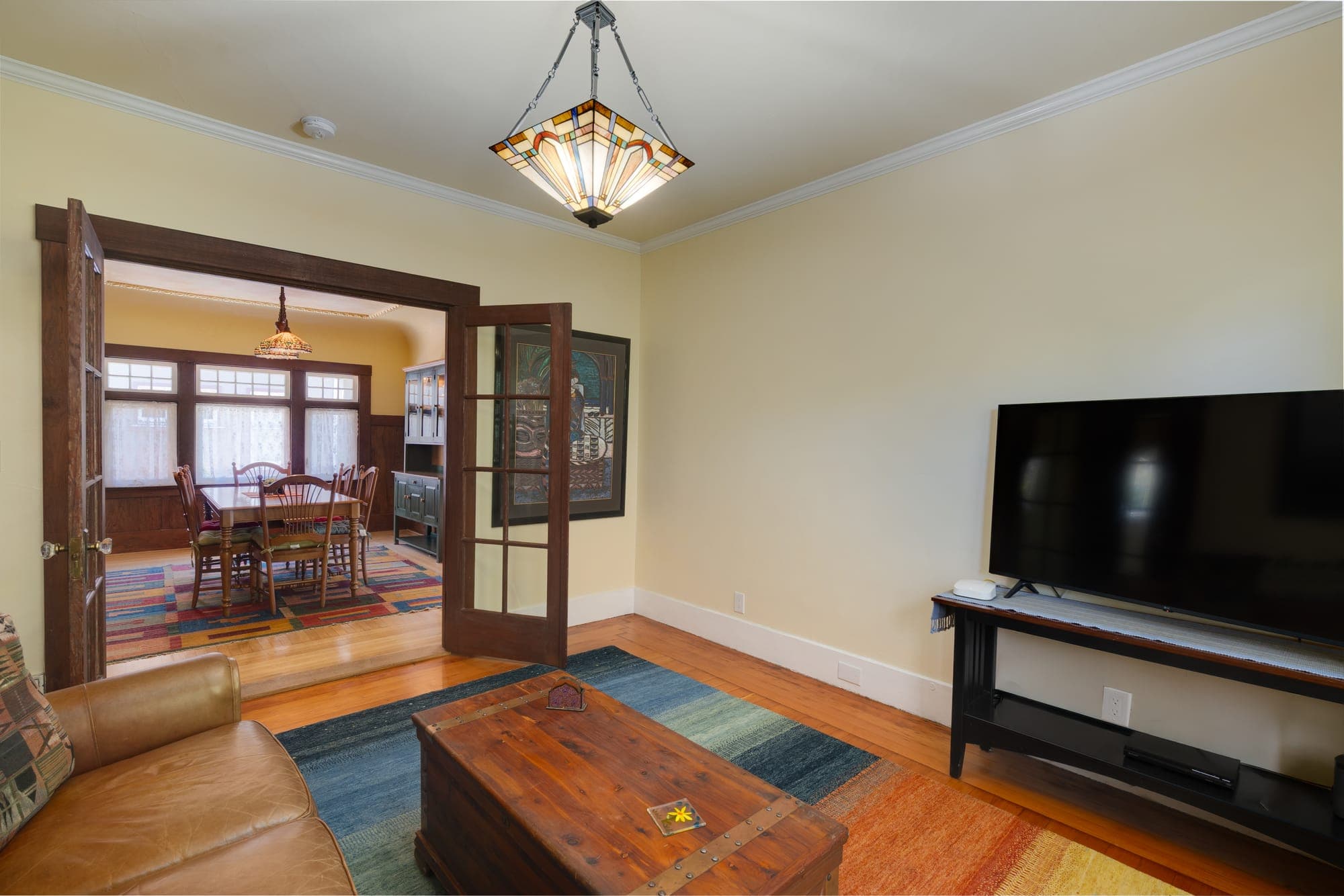 The den's French doors opening toward the dining room.